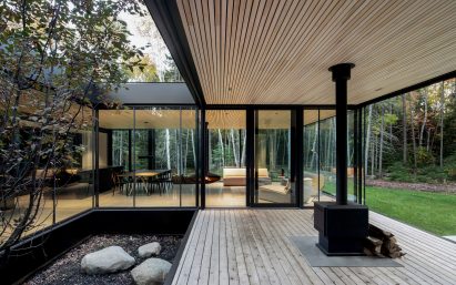 Wooden decking and chimney at Apple Tree House