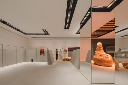 Large mirror inside Acne store designed by Halleroed