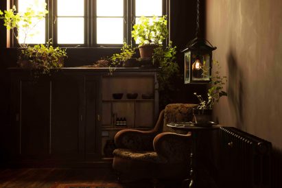 Back room at Aesop store with antique armchair