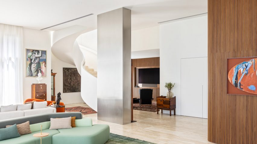Living room with column wrapped in stainless steel