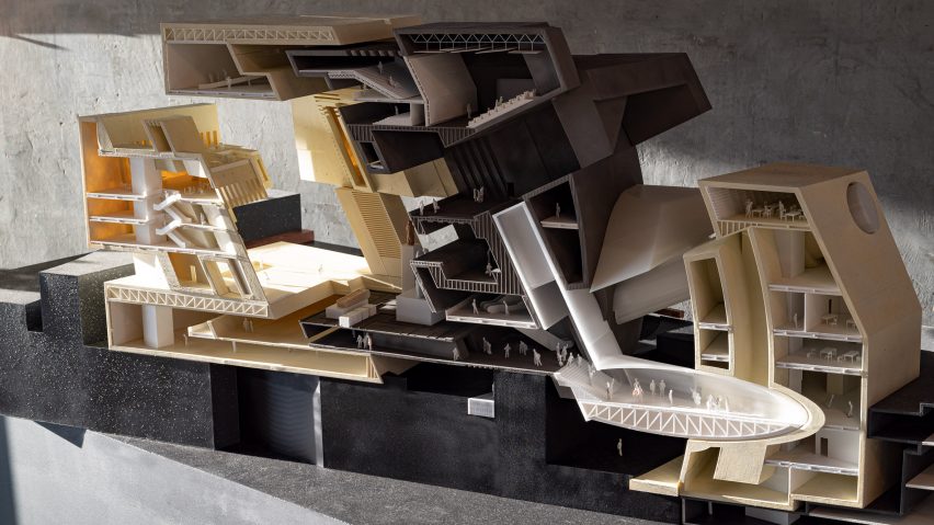Sectional model of multi-level building with scale figures
