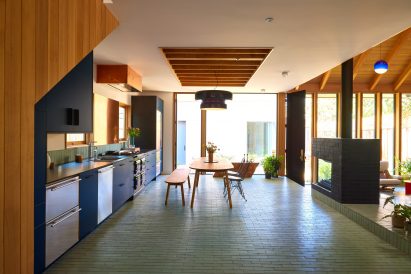Kitchen with turquoise tiles for flooring