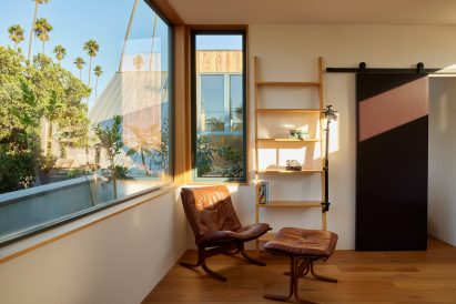 Furniture within guest house by Design, Bitches with large rectilinear windows