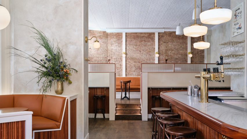 Exposed brick and textured plaster walls at Bar Americano