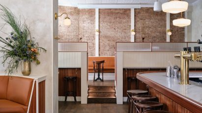 Exposed brick and textured plaster walls at Bar Americano