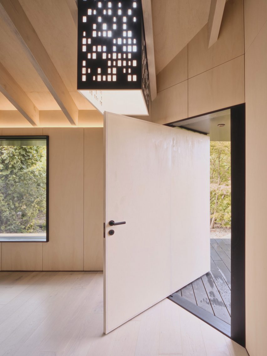 Pivoting door in Dark Matter garden studio by Hyper
