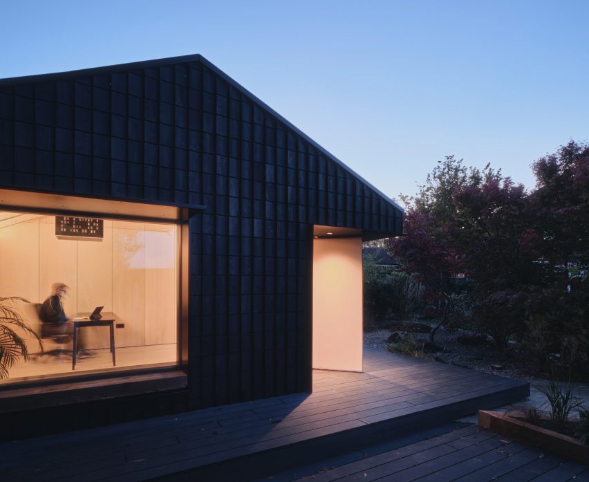 Night view of Dark Matter garden studio by Hyper