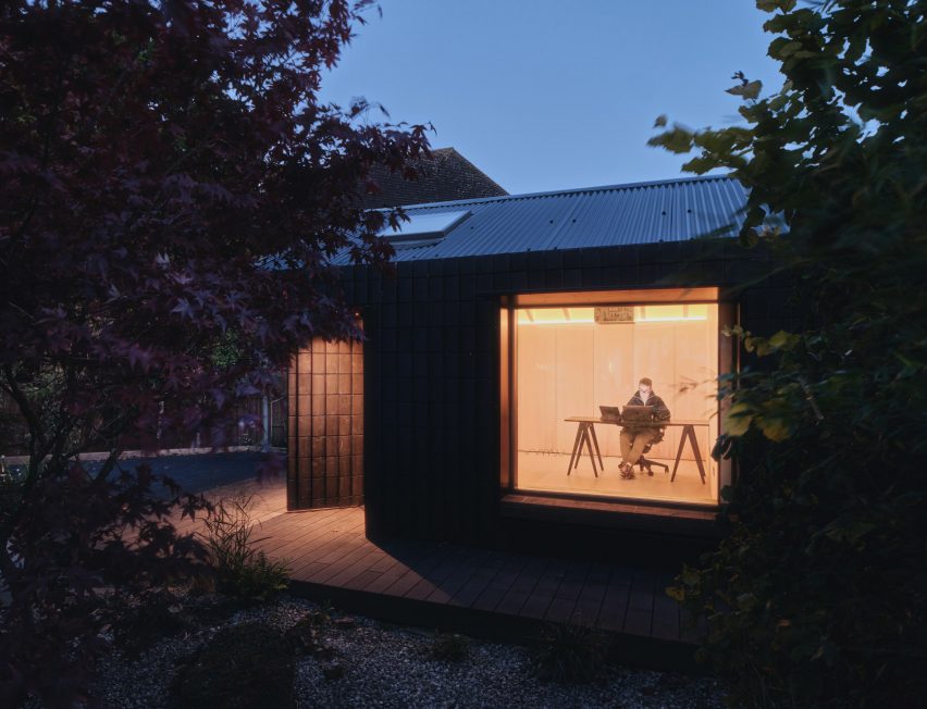 Night view of Dark Matter garden studio by Hyper