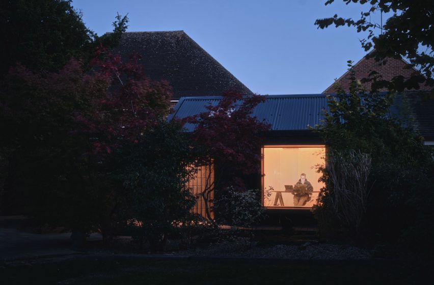 Night view of Dark Matter garden studio by Hyper