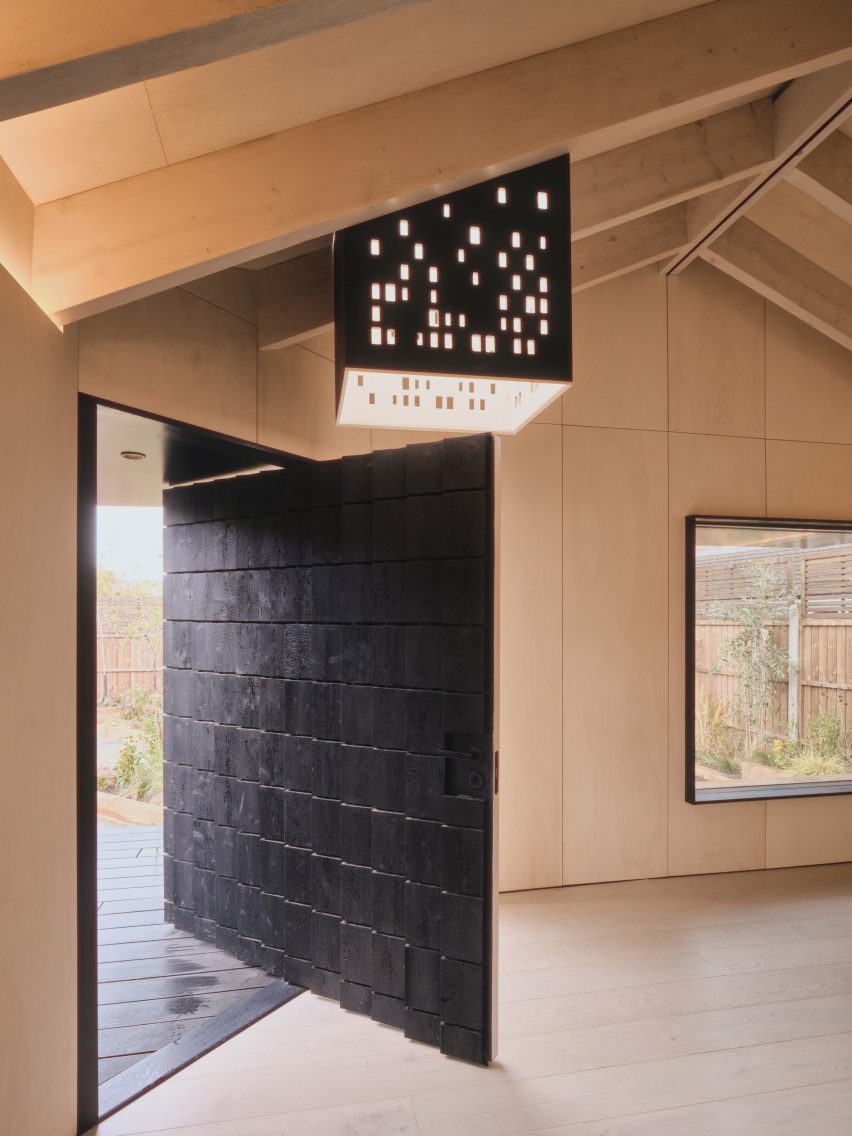 Pivoting door in Dark Matter garden studio by Hyper