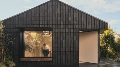 Charred timber facade of Dark Matter garden studio by Hyper