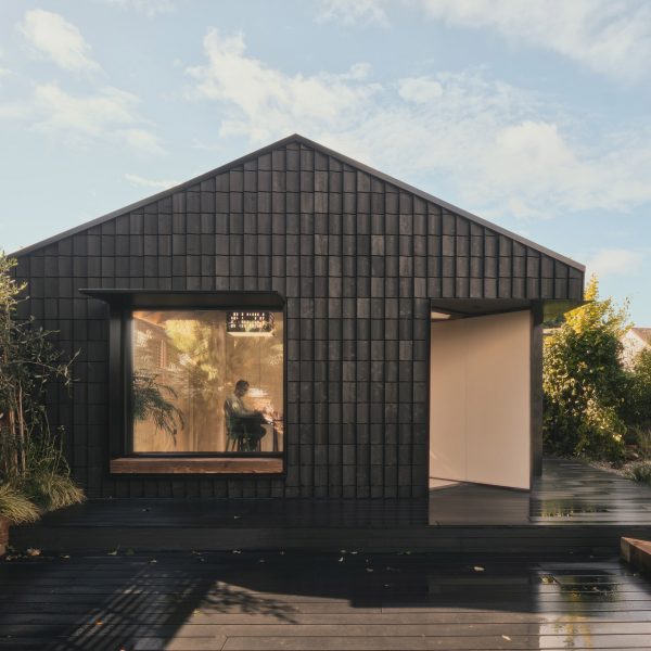 Charred timber facade of Dark Matter garden studio by Hyper