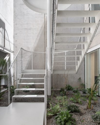 Steel-plated stairway in concrete courtyard