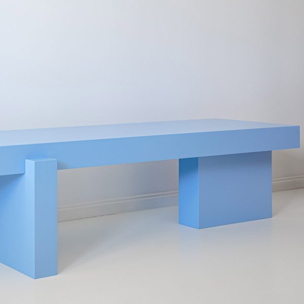 Sky blue sideboard in front of white wall