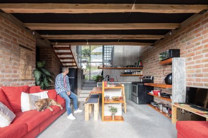 Small kitchen characterised by poured-in-place concrete flooring