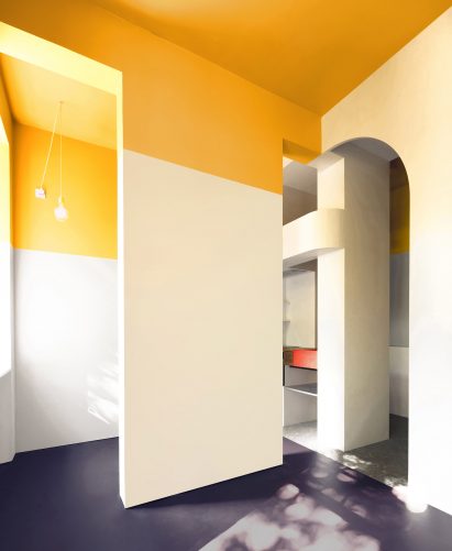 Arched openings and yellow accents within Glasgow apartment