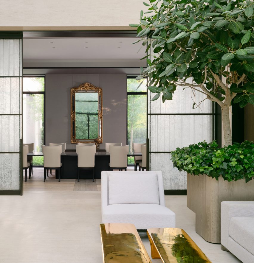 Glass doors roll back to reveal the dining room