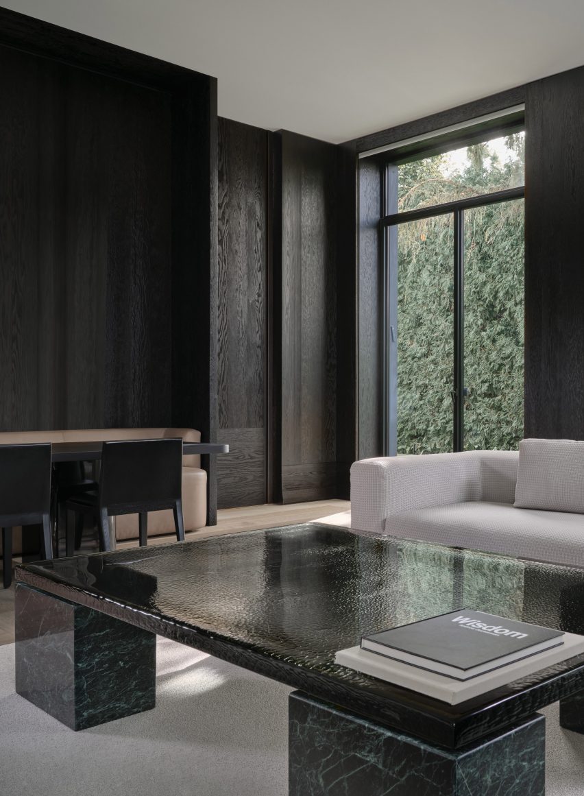 Den clad in blackened wood