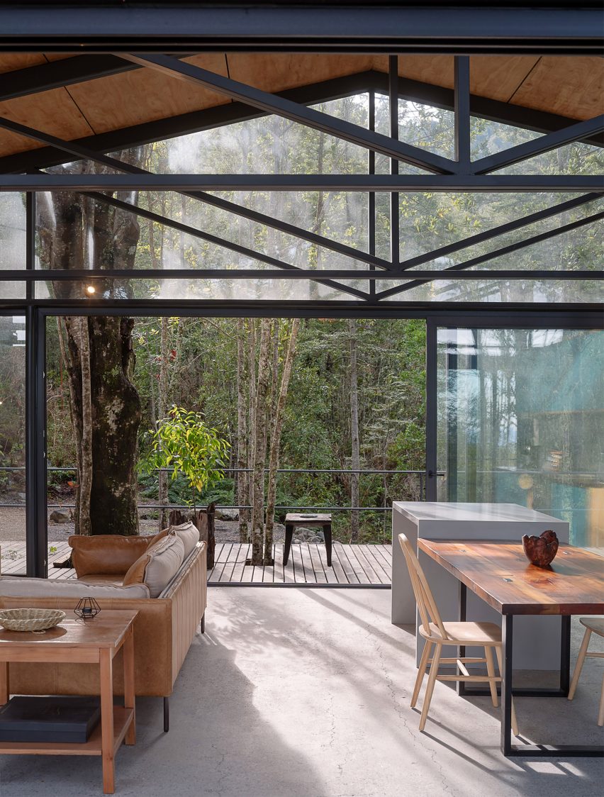 Interior living space and large sliding doors at Quilanto House by Hebra Arquitectos