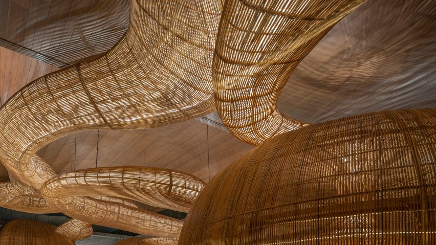 Meandering rattan ceiling installation