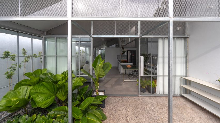 Front porch of a steel-frame home with planting