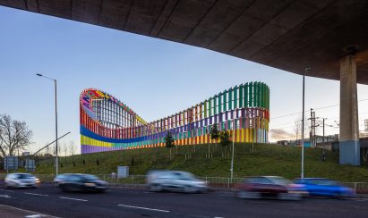 Colourful sculpture next to busy road