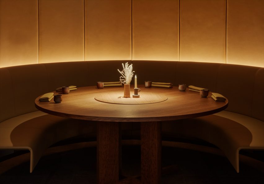 Large round wooden table inside Ikoyi restaurant
