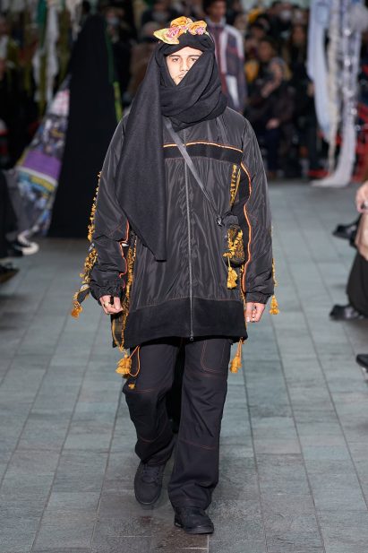 Model wearing Kazna Asker's collection on a runway
