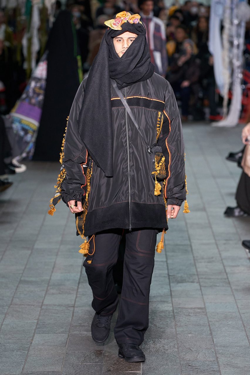 Model wearing Kazna Asker's collection on a runway
