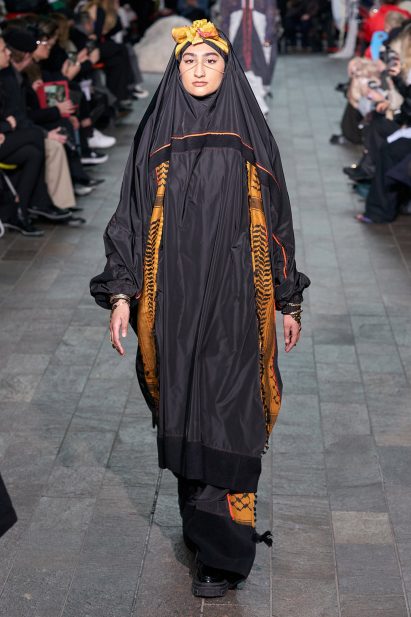 Model wearing Kazna Asker's collection on a runway