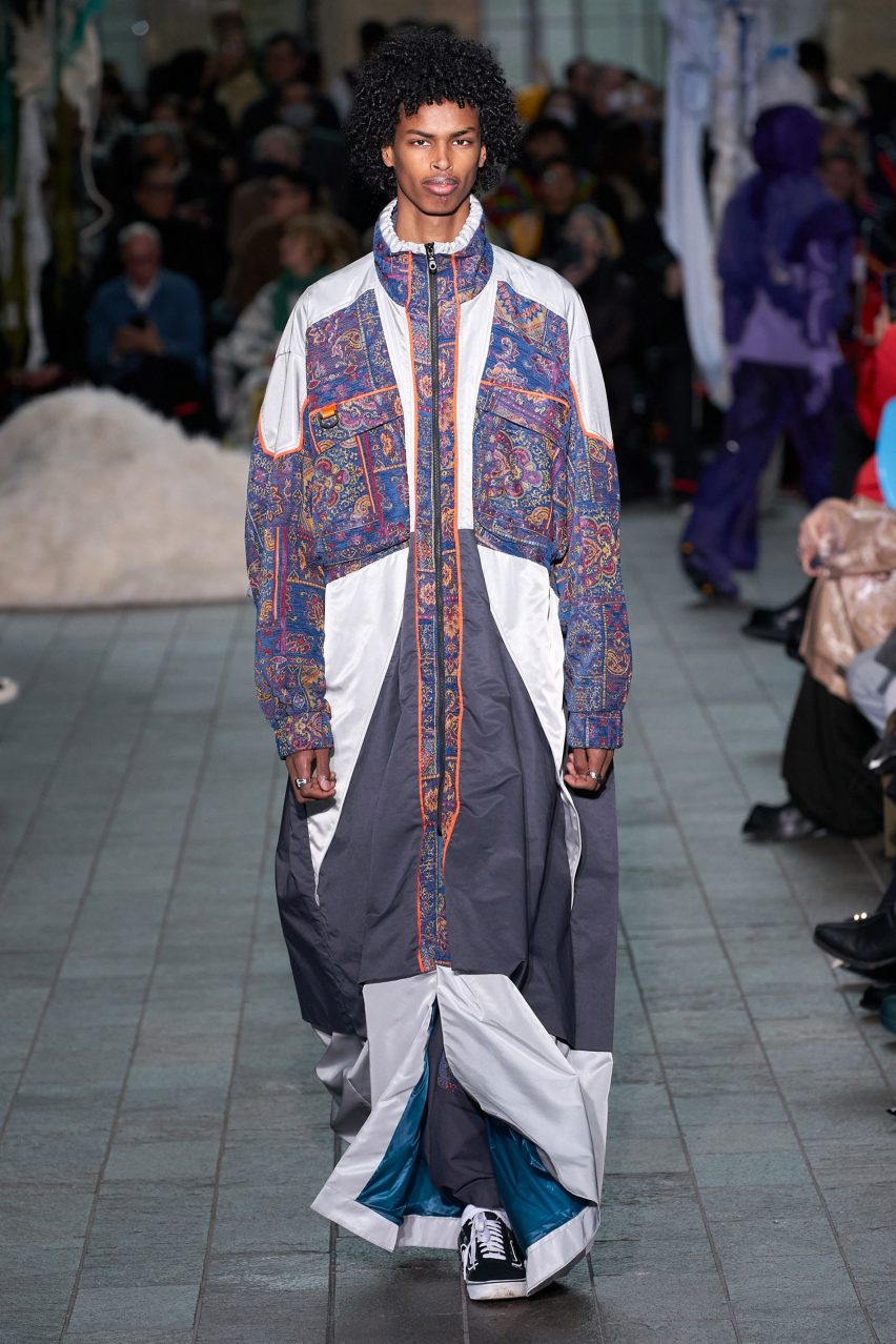 Menswear model wearing the Watered by One Water fashion collection
