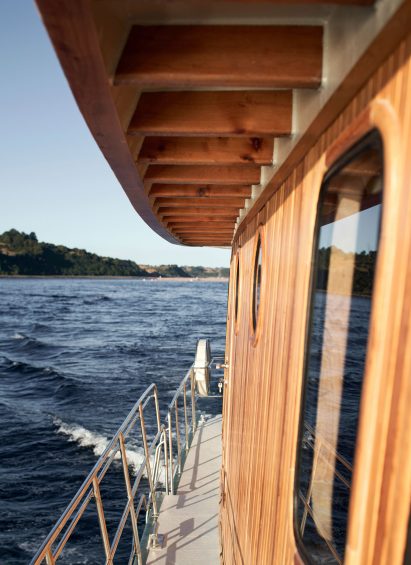 Close up boat exterior with Chilean coast in the background