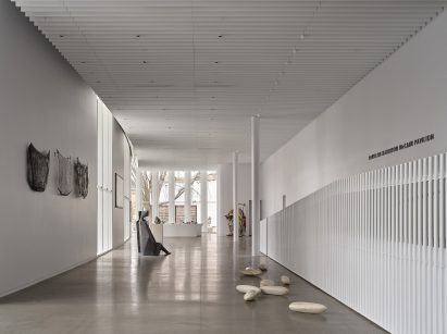Pavilion formed from precast concrete columns to house artwork