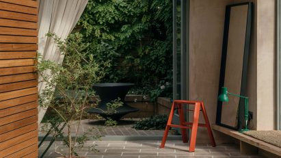 Look through sliding wooden doors into Leyton Garden studio by Paul Westwood