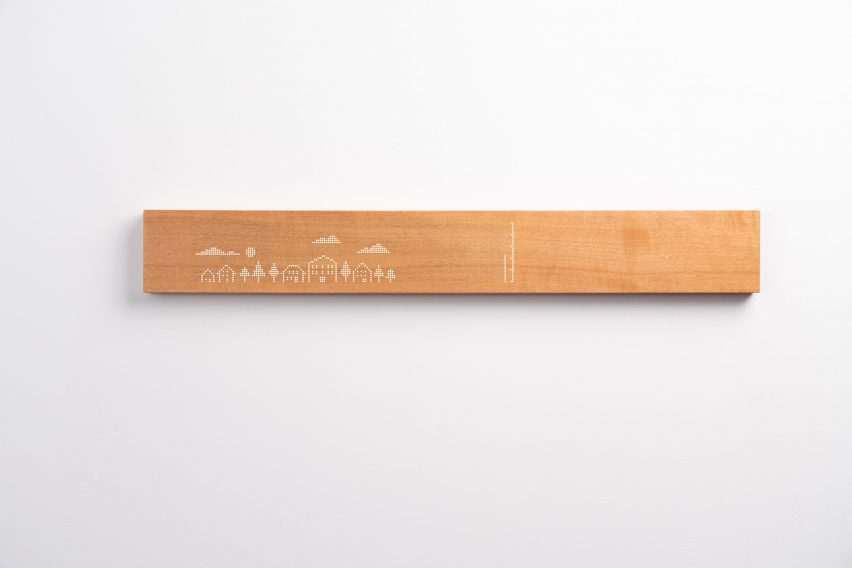 Photo of a drawing displayed on the wooden Mui Board in a white LED dot matrix