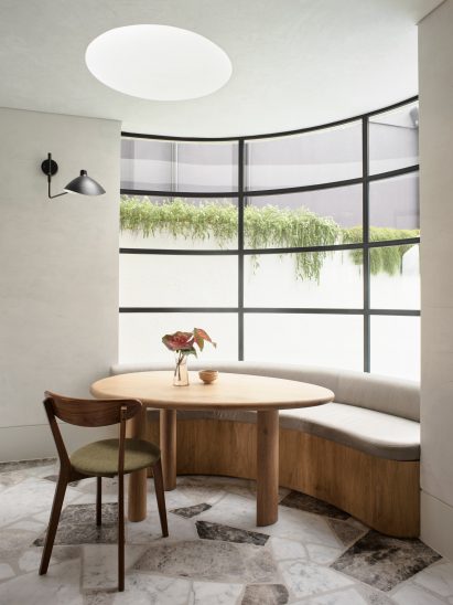 Breakfast nook in front of curved window
