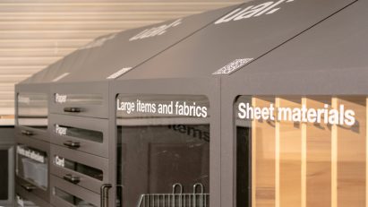 Row of Re-Use storage units labelled for different materials