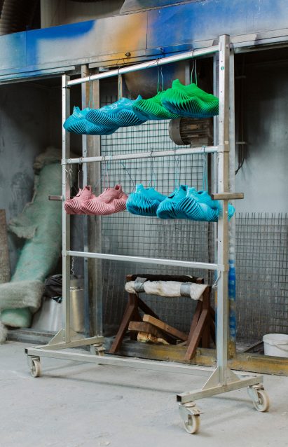 Reebok trainers hanging on a rail