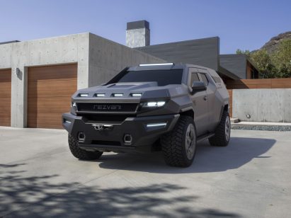 The front of a blue SUV by Rezvani Motors