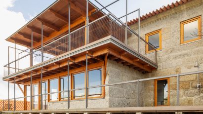 Stone walls of new bedroom wing at São Cosme House by Carlos Castanheira