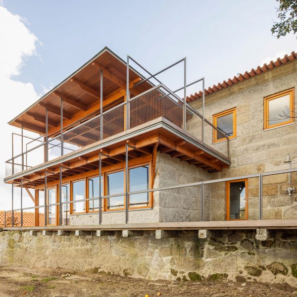 Stone walls of new bedroom wing at São Cosme House by Carlos Castanheira
