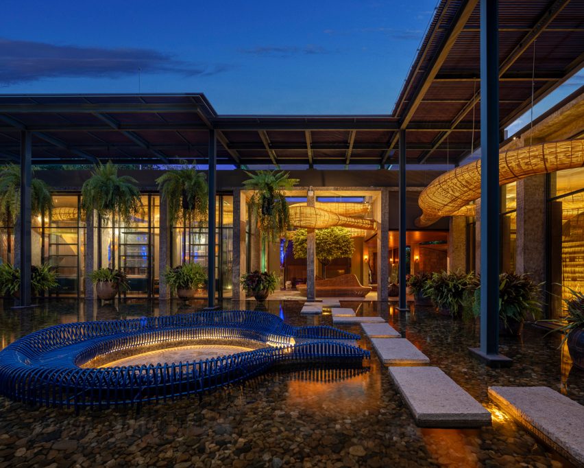 Meandering rattan structure incorporated into outdoor landscaping by Enter Projects Asia