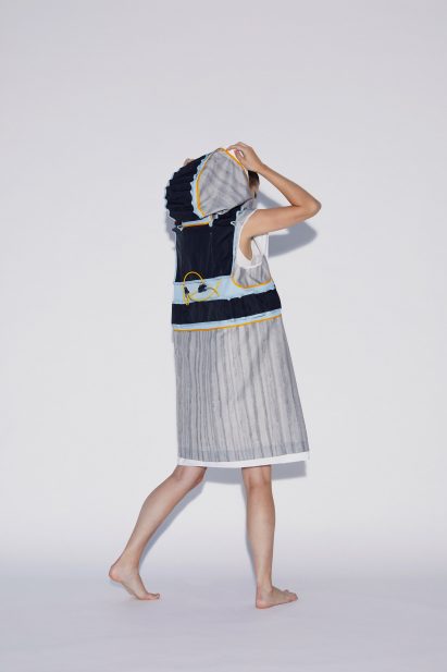 Model wearing Soft Assembly hooded vest by Pola Demianiuk