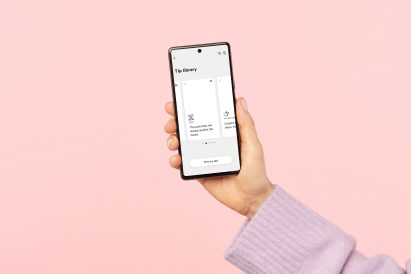 A hand holds a smartphone displaying a card-shaped box with text that reads the past does not always predict the future