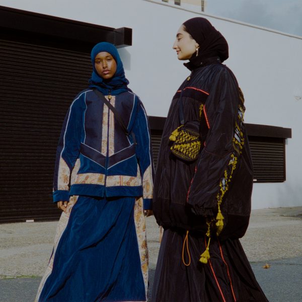 Two models wearing Kazna Asker's fashion collection