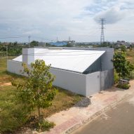 Exterior of a steel mono-pitched house in Vietnam by MIA Design Studio