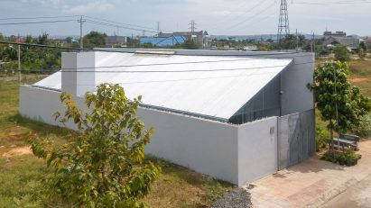 Exterior of a steel mono-pitched house in Vietnam by MIA Design Studio
