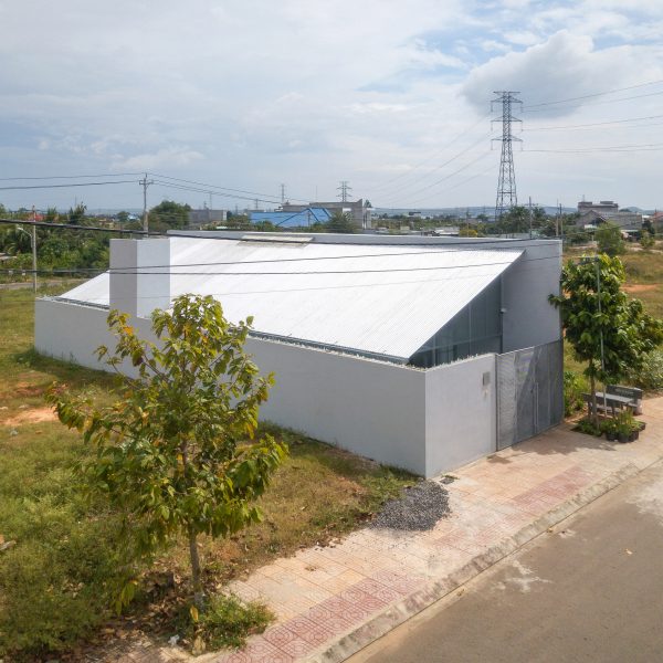 Exterior of a steel mono-pitched house in Vietnam by MIA Design Studio