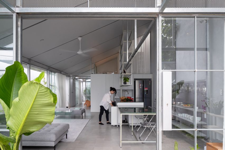 Open plan steel kitchen and living space with mono-pitched roof