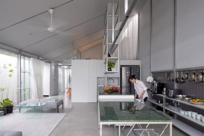 Open-plan kitchen and living space by MIA Design Studio